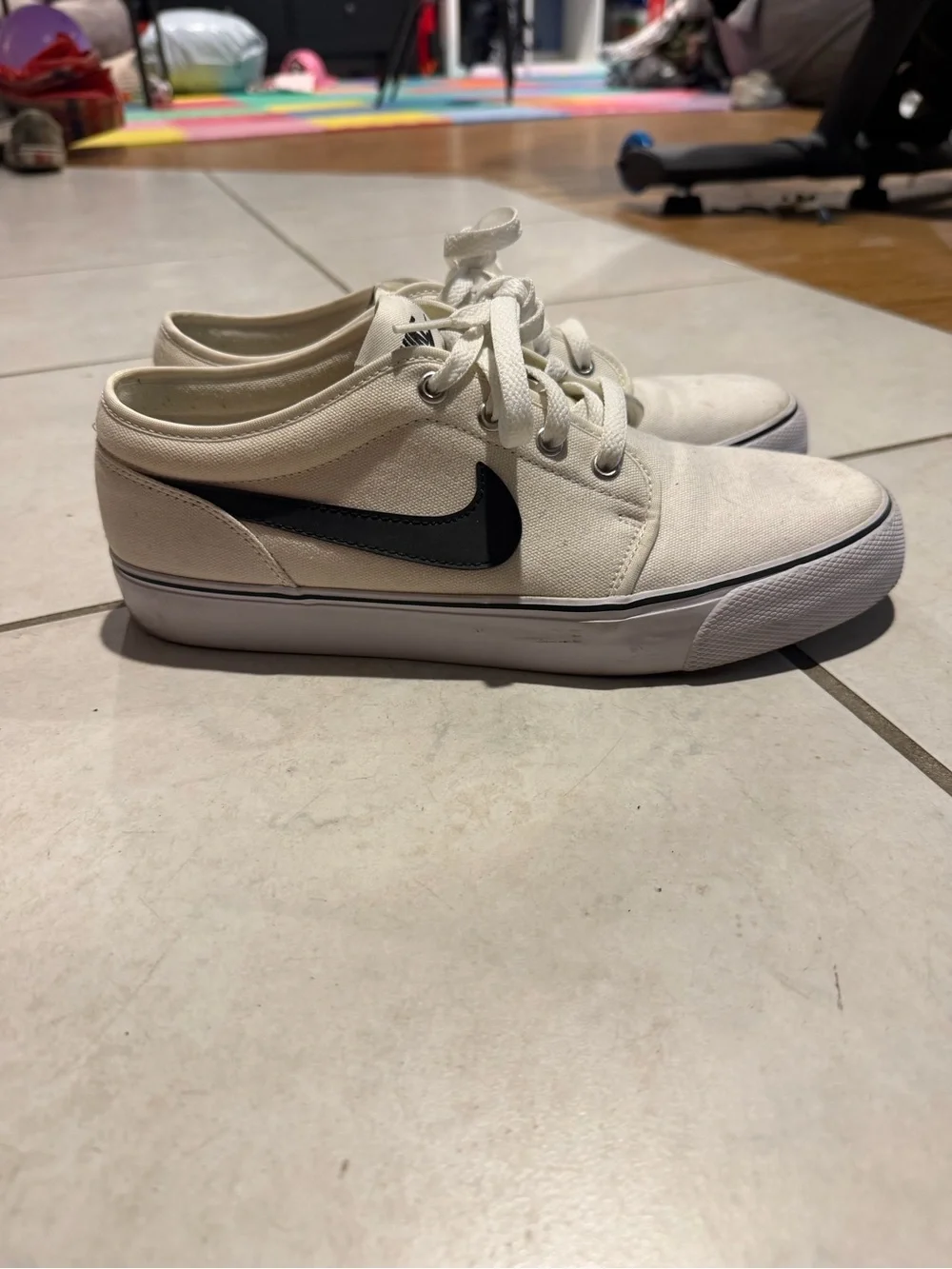 Nike White Canvas Low-Top Sneakers with Black Swoosh